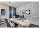 Bright home office with modern decor and faux white brick wall with accent decorations at 20125 E Via Del Rancho --, Queen Creek, AZ 85142