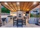 Outdoor kitchen features a pizza oven, a dining table, and an outdoor lounge at 20125 E Via Del Rancho --, Queen Creek, AZ 85142