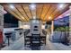 Expansive outdoor kitchen and dining area with wood fired pizza oven under a covered patio at 20125 E Via Del Rancho --, Queen Creek, AZ 85142