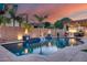 Gorgeous pool with waterfalls, fire bowls, and an outdoor kitchen creating an ideal space for relaxation at 20125 E Via Del Rancho --, Queen Creek, AZ 85142