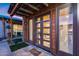 Close-up of the pool house with inviting wood paneled doors and large windows at 20125 E Via Del Rancho --, Queen Creek, AZ 85142