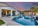 Backyard pool showcasing travertine decking, a private cabana, and a lush landscape at 20125 E Via Del Rancho --, Queen Creek, AZ 85142