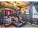 Comfortable theater room with wood ceiling, soft lighting, and plush leather reclining seats at 20125 E Via Del Rancho --, Queen Creek, AZ 85142
