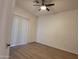 The bright bedroom has hard surface floors, neutral walls and ceiling fan at 2035 S Elm St # 114, Tempe, AZ 85282