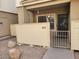 A close up of the entrance to unit 114 featuring private gate and desert landscaping of rocks and pavers at 2035 S Elm St # 114, Tempe, AZ 85282
