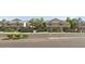 Inviting two-story townhomes with neutral exterior and lush greenery along a street at 2035 S Elm St # 114, Tempe, AZ 85282