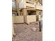 A view of the exterior showing the private entrance to a condo, with desert landscaping including stones and pavers at 2035 S Elm St # 114, Tempe, AZ 85282