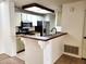 Charming kitchen with stainless steel appliances and a breakfast bar at 2035 S Elm St # 114, Tempe, AZ 85282