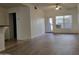 Bright living room features hard surface floors and door to the exterior patio at 2035 S Elm St # 114, Tempe, AZ 85282