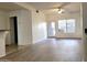 Bright living room featuring hard surface floors, large windows, and ceiling fan at 2035 S Elm St # 114, Tempe, AZ 85282
