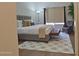 Stylish main bedroom features neutral tones, a sitting area and plenty of natural light at 2035 S Elm St # 114, Tempe, AZ 85282