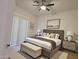 Comfortable main bedroom featuring neutral tones, stylish decor, and an abundance of natural light at 2035 S Elm St # 114, Tempe, AZ 85282