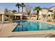 Community pool with lounge chairs at 2035 S Elm St # 114, Tempe, AZ 85282