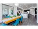 Open-concept dining area adjacent to the kitchen, featuring a modern wooden table and seating at 22695 S 220Th St, Queen Creek, AZ 85142