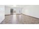 Tiled living room with white walls, glass doors to yard, and natural light at 22799 W Morning Glory St, Buckeye, AZ 85326