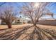 Lawn and backyard area featuring tall tree, a covered patio, play area and fencing at 2320 E Harvard St, Phoenix, AZ 85006
