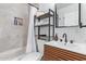 Modern bathroom featuring a stylish vanity and shelving in the shower at 2320 E Harvard St, Phoenix, AZ 85006