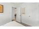 A bright bedroom showing the bedroom's interior, door, and white color scheme at 2320 E Harvard St, Phoenix, AZ 85006