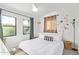Charming bedroom with natural light from dual windows and flower accent wall at 2320 E Harvard St, Phoenix, AZ 85006