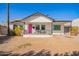 Charming single-Gathering home with freshly painted white exterior, a pink door, and inviting front porch at 2320 E Harvard St, Phoenix, AZ 85006