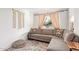 A cozy living room with a comfortable couch, patterned rug, and great natural light at 2320 E Harvard St, Phoenix, AZ 85006