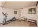 Covered patio with exercise equipment and extra seating for outdoor relaxation at 2320 E Harvard St, Phoenix, AZ 85006