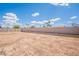 Large, open backyard with a privacy fence, ideal for creating your dream outdoor space at 2359 W Del Oro Cir, Mesa, AZ 85202