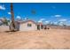 Vast backyard featuring a covered patio and promising endless possibilities for outdoor living at 2359 W Del Oro Cir, Mesa, AZ 85202