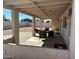 Covered patio with outdoor seating in a landscaped backyard at 2359 W Del Oro Cir, Mesa, AZ 85202