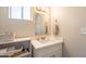Bright bathroom with neutral walls, white vanity with storage at 2359 W Del Oro Cir, Mesa, AZ 85202