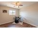 Simple bedroom featuring a drum set and carpet on the floor, natural lighting, and clean walls at 2359 W Del Oro Cir, Mesa, AZ 85202