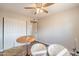 Cozy bedroom featuring neutral walls, hardwood floors, and a ceiling fan at 2359 W Del Oro Cir, Mesa, AZ 85202