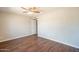 Empty bedroom featuring hardwood floors, plenty of natural light and space for furniture at 2359 W Del Oro Cir, Mesa, AZ 85202