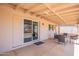 Relaxing covered patio with comfortable seating, perfect for outdoor entertaining at 2359 W Del Oro Cir, Mesa, AZ 85202