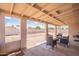 Inviting covered patio with outdoor seating offers a pleasant space to unwind at 2359 W Del Oro Cir, Mesa, AZ 85202