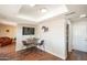 Cozy dining area with a modern tv, dining table, stylish chairs, and hardwood floors at 2359 W Del Oro Cir, Mesa, AZ 85202