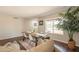Cozy dining area with a wooden table, comfortable couch, and a view of the outdoors at 2359 W Del Oro Cir, Mesa, AZ 85202
