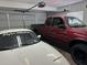 Inside the garage with two vehicles and ample space, ensuring secure parking and storage at 2359 W Del Oro Cir, Mesa, AZ 85202