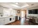 Well-lit kitchen with white cabinets, modern appliances, and a view of the dining area and backyard at 2359 W Del Oro Cir, Mesa, AZ 85202
