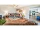 Open-concept living room with dark hardwood floors, large gray sectional couch, and adjacent kitchen at 2359 W Del Oro Cir, Mesa, AZ 85202