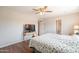 Main bedroom featuring hardwood floors, a TV, and a ceiling fan at 2359 W Del Oro Cir, Mesa, AZ 85202