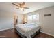 Spacious main bedroom with hardwood floors and an adjoined bathroom at 2359 W Del Oro Cir, Mesa, AZ 85202