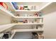 Organized pantry with shelving provides ample storage for food and household items at 2359 W Del Oro Cir, Mesa, AZ 85202