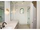 Bathroom with a walk-in shower, modern lighting, vanity with sink, and elegant finishes at 23779 N 91St St, Scottsdale, AZ 85255