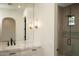 Bathroom featuring a walk-in shower, marble countertops, modern fixtures, and a large mirror at 23779 N 91St St, Scottsdale, AZ 85255