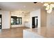 Bright dining area with recessed lights, glass enclosed wine storage, and wet bar at 23779 N 91St St, Scottsdale, AZ 85255