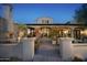 Inviting home entrance with stone pathway and mature desert landscaping, creating curb appeal at 23779 N 91St St, Scottsdale, AZ 85255