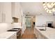 Open kitchen with marble counters, stainless appliances and wine storage at 23779 N 91St St, Scottsdale, AZ 85255
