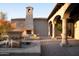This tranquil patio includes a water feature, fireplace, and detailed stonework creating an inviting outdoor space at 23779 N 91St St, Scottsdale, AZ 85255