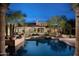 Stunning backyard view featuring a private pool reflecting the architecture of this luxury estate at 23779 N 91St St, Scottsdale, AZ 85255